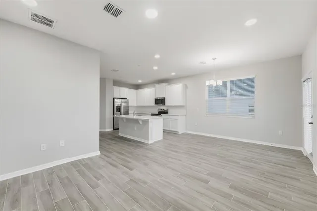 a view of kitchen with wooden floor