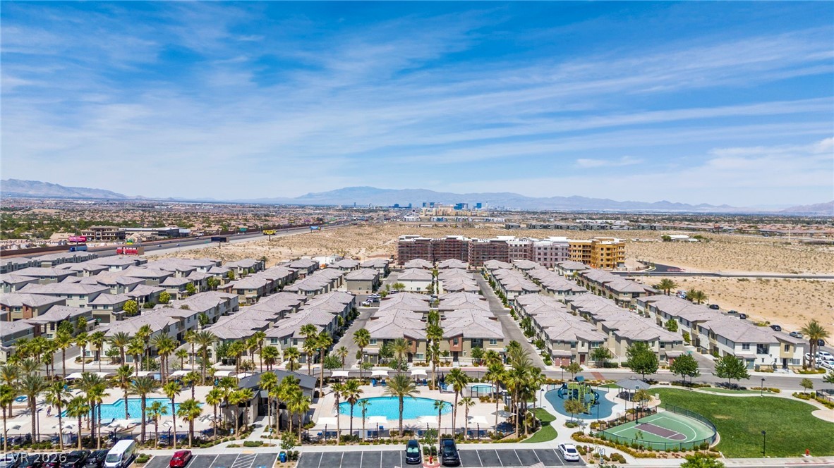 12367 Indigo Montage Road, Unit 3 Las Vegas, NV 89183 - Photo 32 of 33 An aerial perspective reveals a vibrant community with recreational amenities and desert views.
