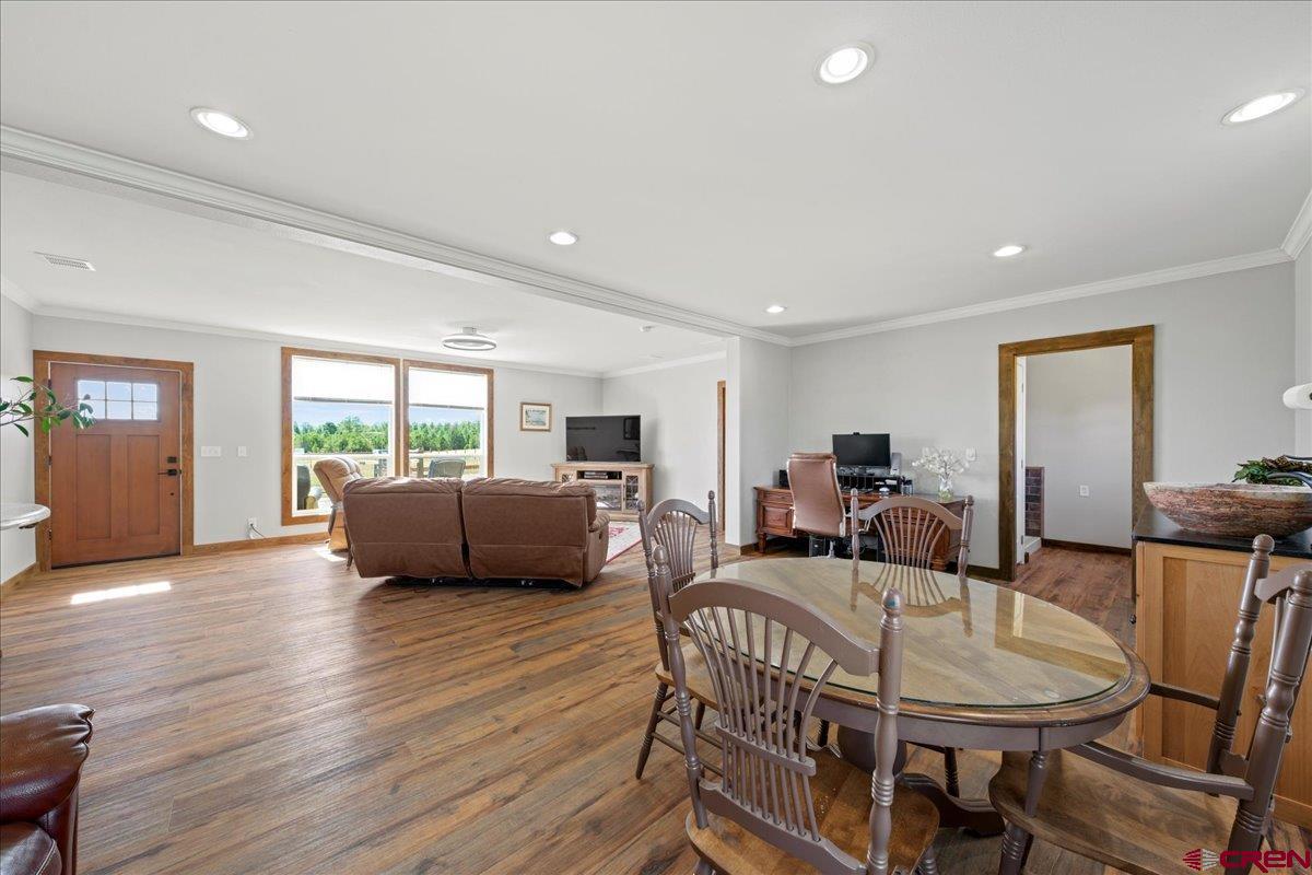 234 Thistle Drive Montrose, CO 81403 - Photo 16 of 39 a living room with furniture and a wooden floor