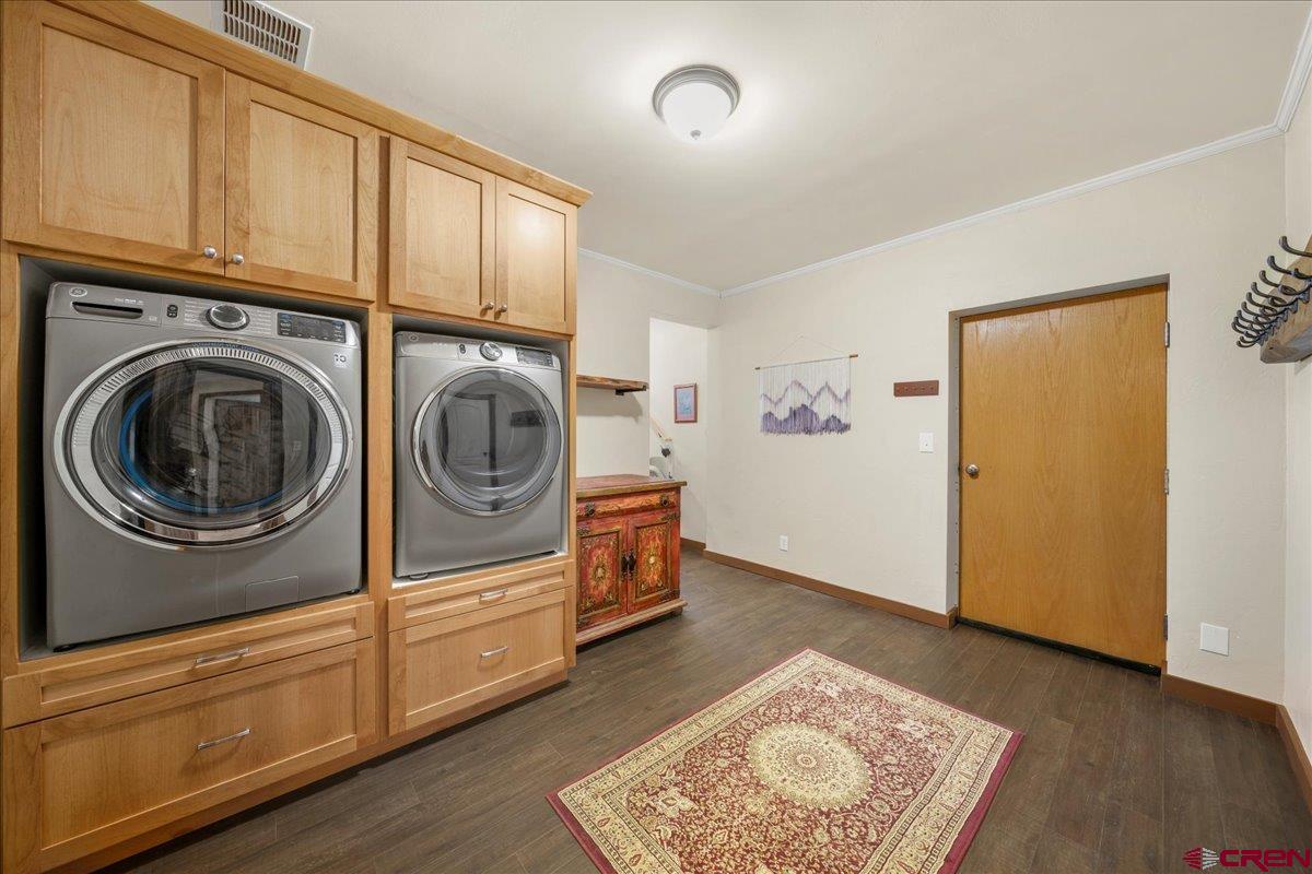 234 Thistle Drive Montrose, CO 81403 - Photo 18 of 39 a view of a storage & utility room with washer and dryer