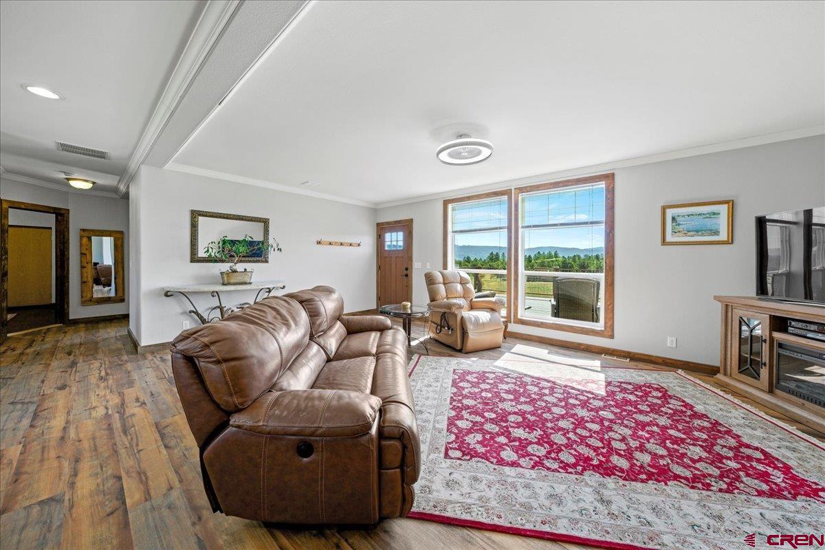 234 Thistle Drive Montrose, CO 81403 - Photo 21 of 39 a living room with furniture and a rug