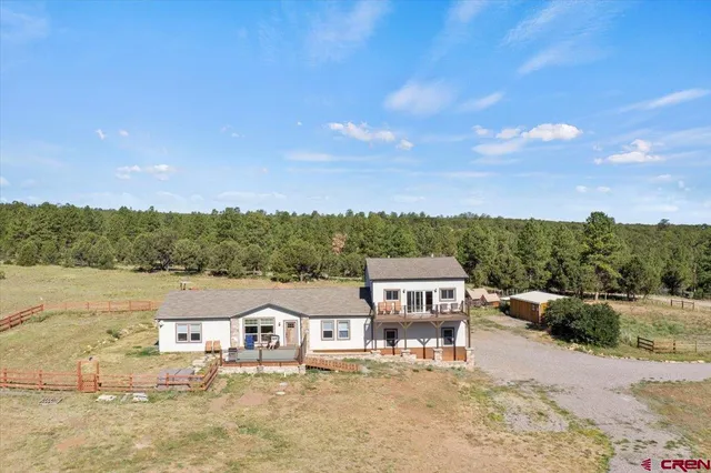 a view of house with outdoor space and river