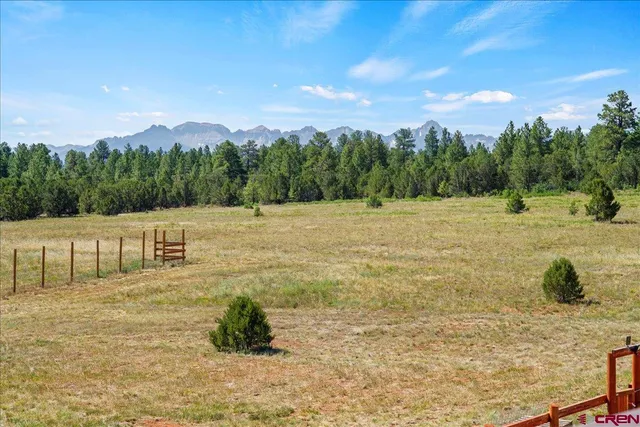 a view of a lake with a yard