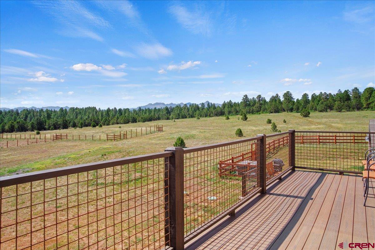 234 Thistle Drive Montrose, CO 81403 - Photo 33 of 39 a view of wooden deck with a lake view
