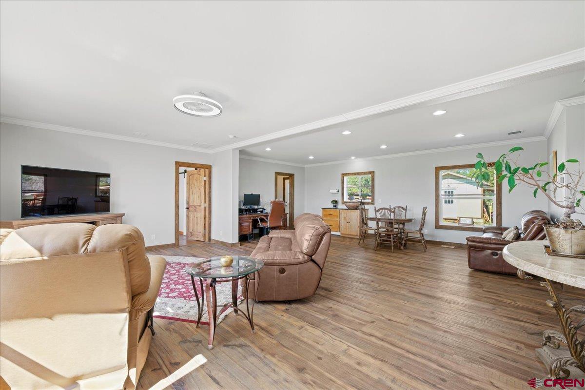 234 Thistle Drive Montrose, CO 81403 - Photo 34 of 39 a living room with furniture and a flat screen tv
