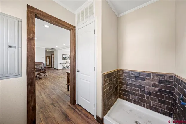 a view of hallway with wooden floor