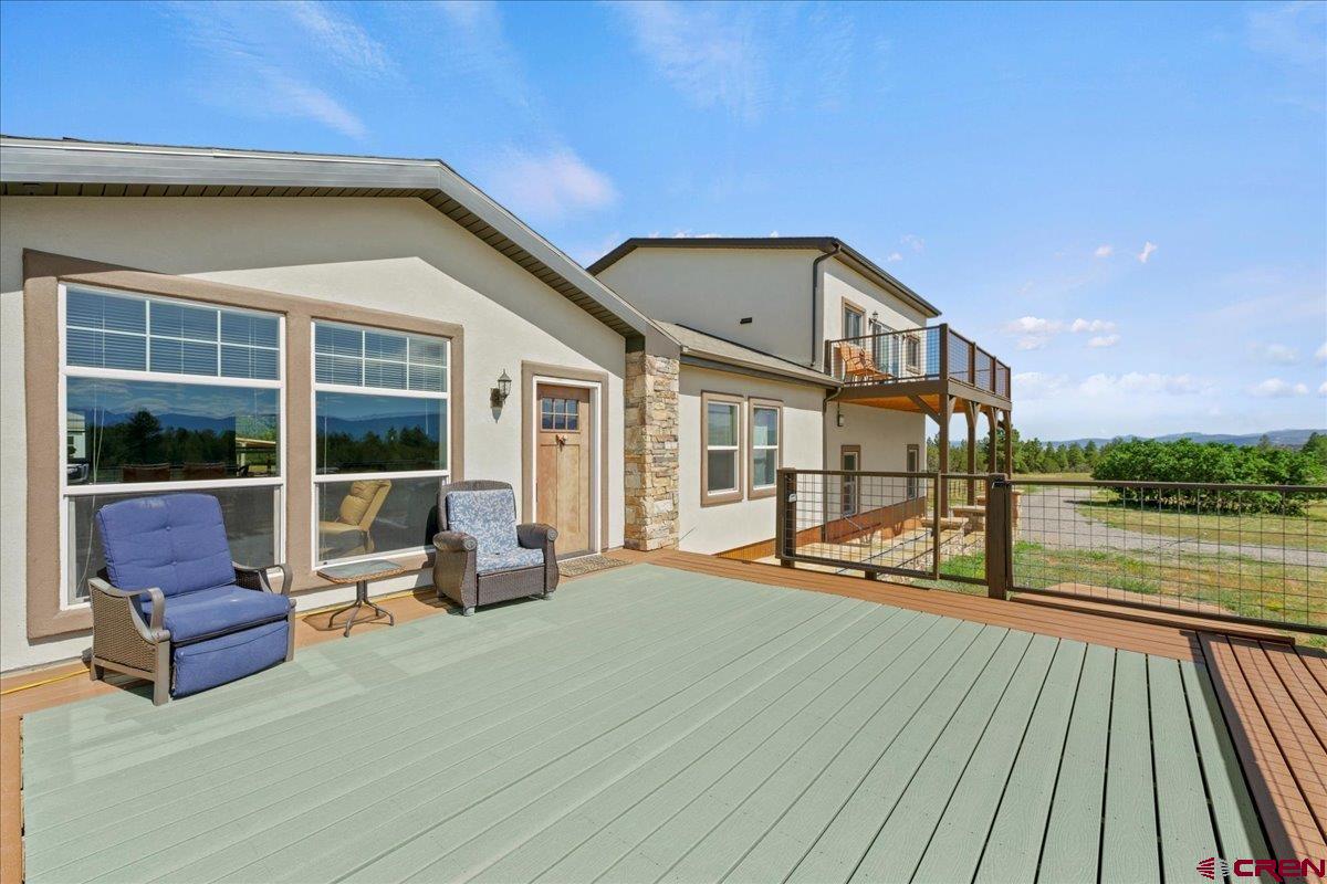 234 Thistle Drive Montrose, CO 81403 - Photo 7 of 39 a view of swimming pool with seating space and ocean view