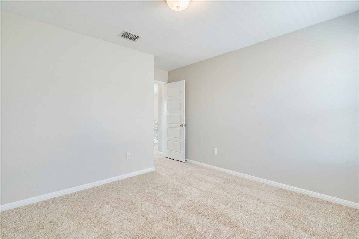 10317 Laurie Lane Austin, TX 78747 - Photo 21 of 35 Carpeted empty room with baseboards