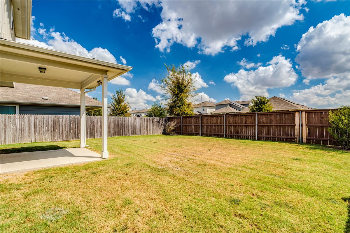 10317 Laurie Lane Austin, TX 78747 - Photo 28 of 35 Fenced backyard with a patio area