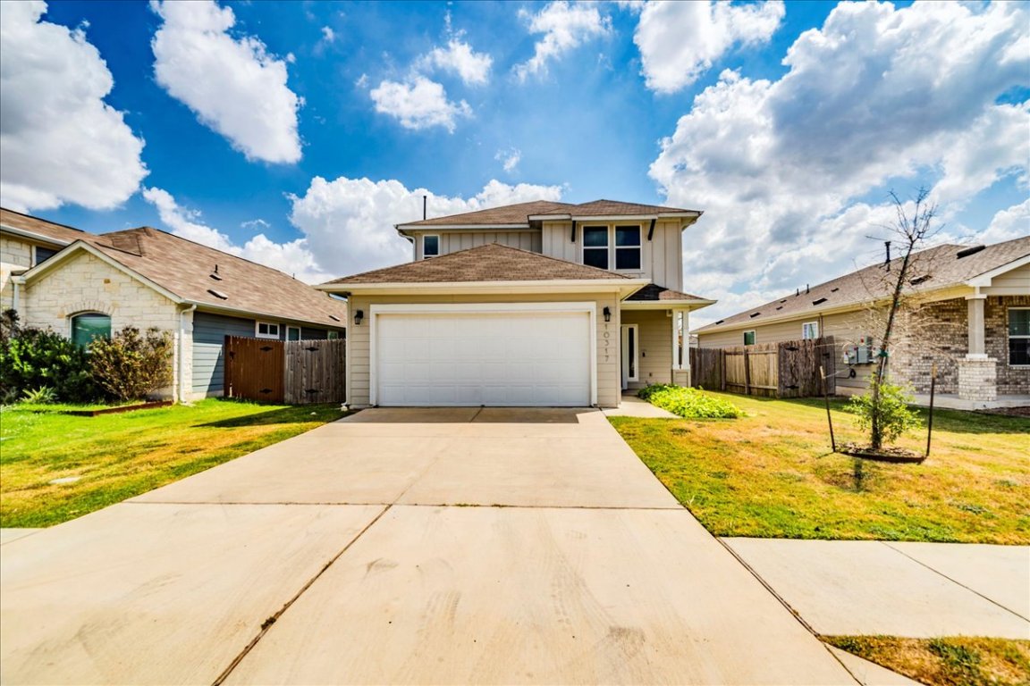 10317 Laurie Lane Austin, TX 78747 - Photo 30 of 35 a front view of a house with a garden