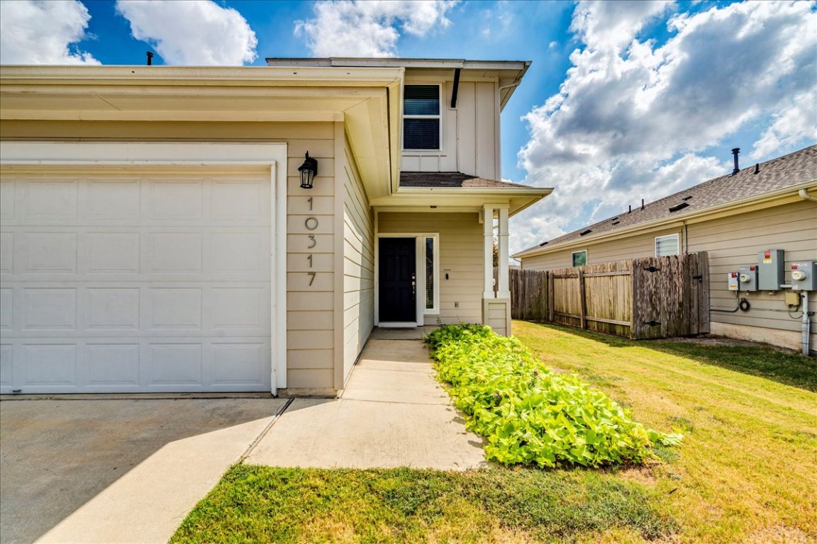 10317 Laurie Lane Austin, TX 78747 - Photo 4 of 35 a front view of a house with a yard