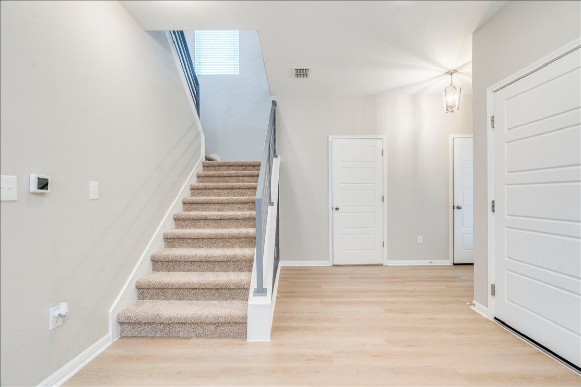 10317 Laurie Lane Austin, TX 78747 - Photo 5 of 35 a view of an entryway with staircase
