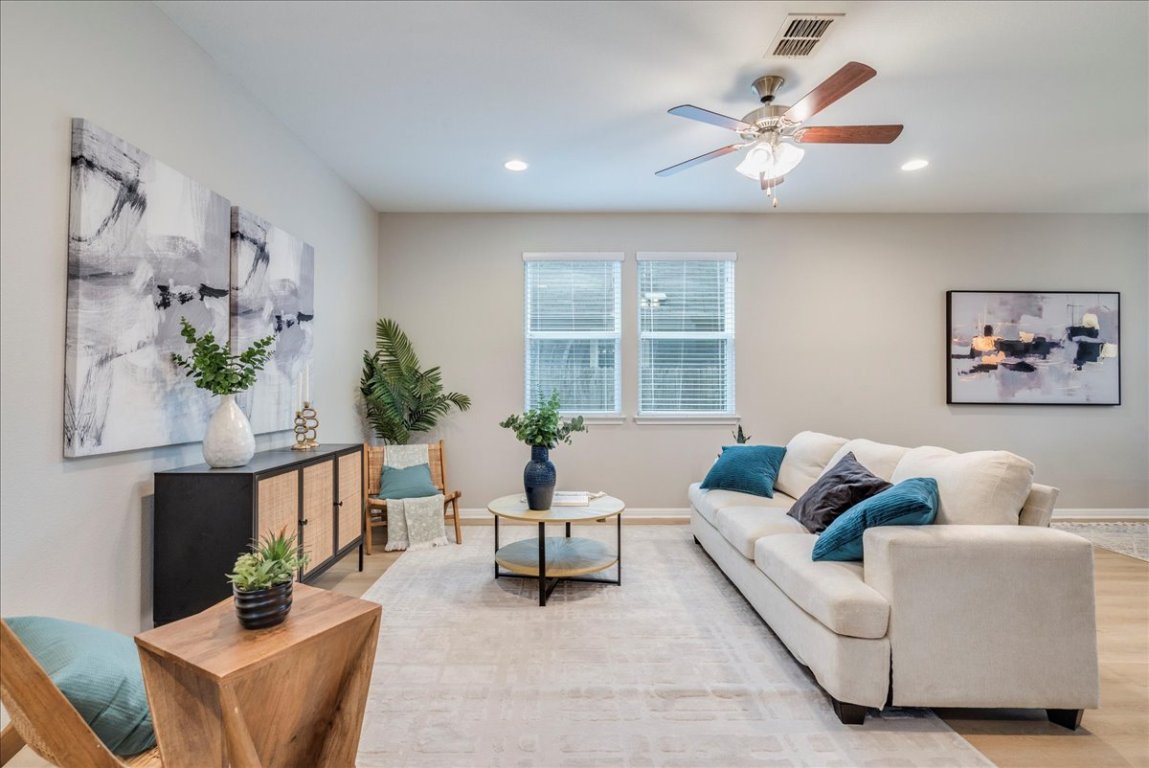 10317 Laurie Lane Austin, TX 78747 - Photo 6 of 35 a living room with furniture and a large window