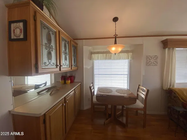 a view of a dining room and chairs