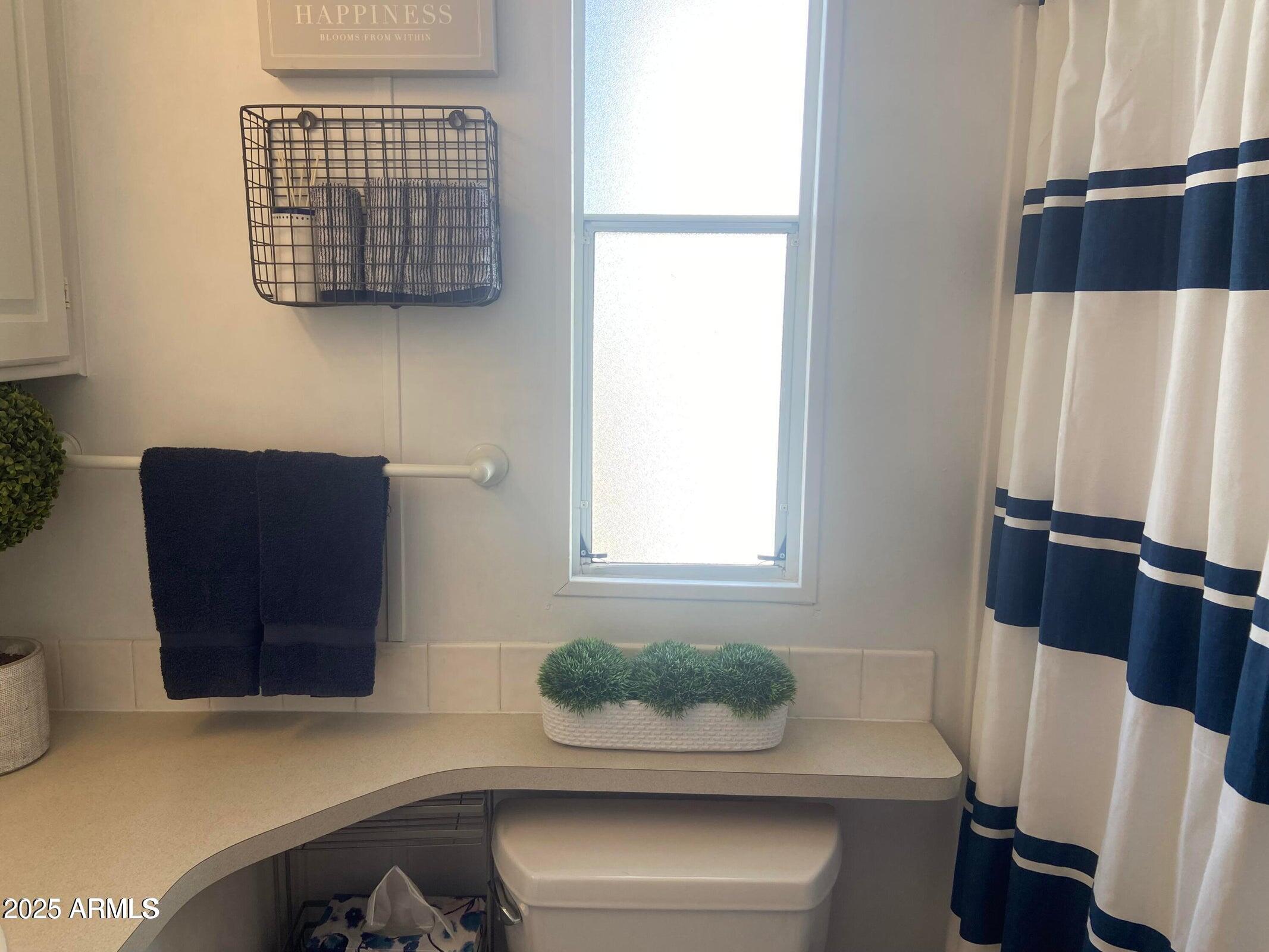 1426 South Havasupai Drive Apache Junction, AZ 85119 - Photo 13 of 32 a bathroom with a sink and a mirror