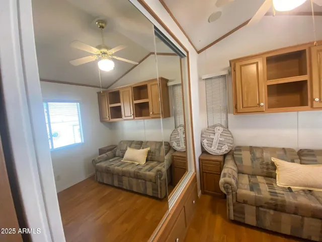 a bedroom with furniture and a window