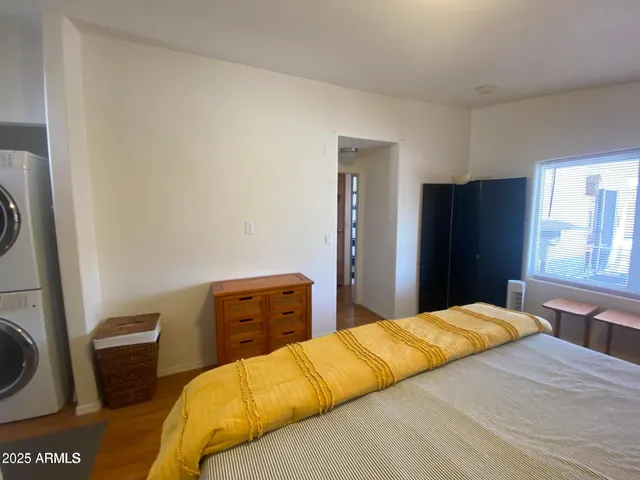 a bedroom with a bed and a closet