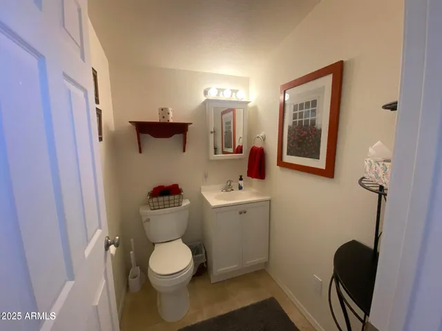 a bathroom with a toilet and a sink