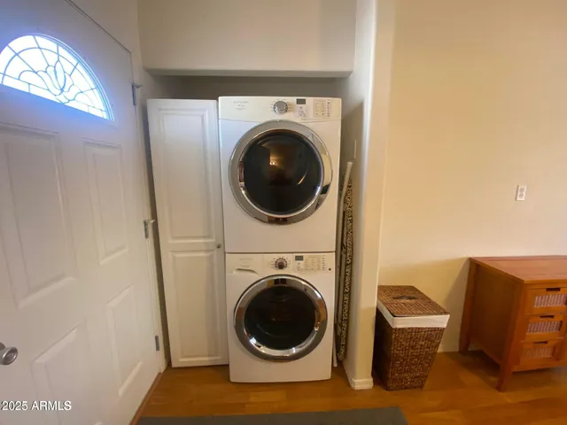 a view of a hallway with washer and dryer