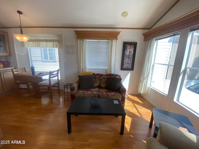 a living room with furniture and a table