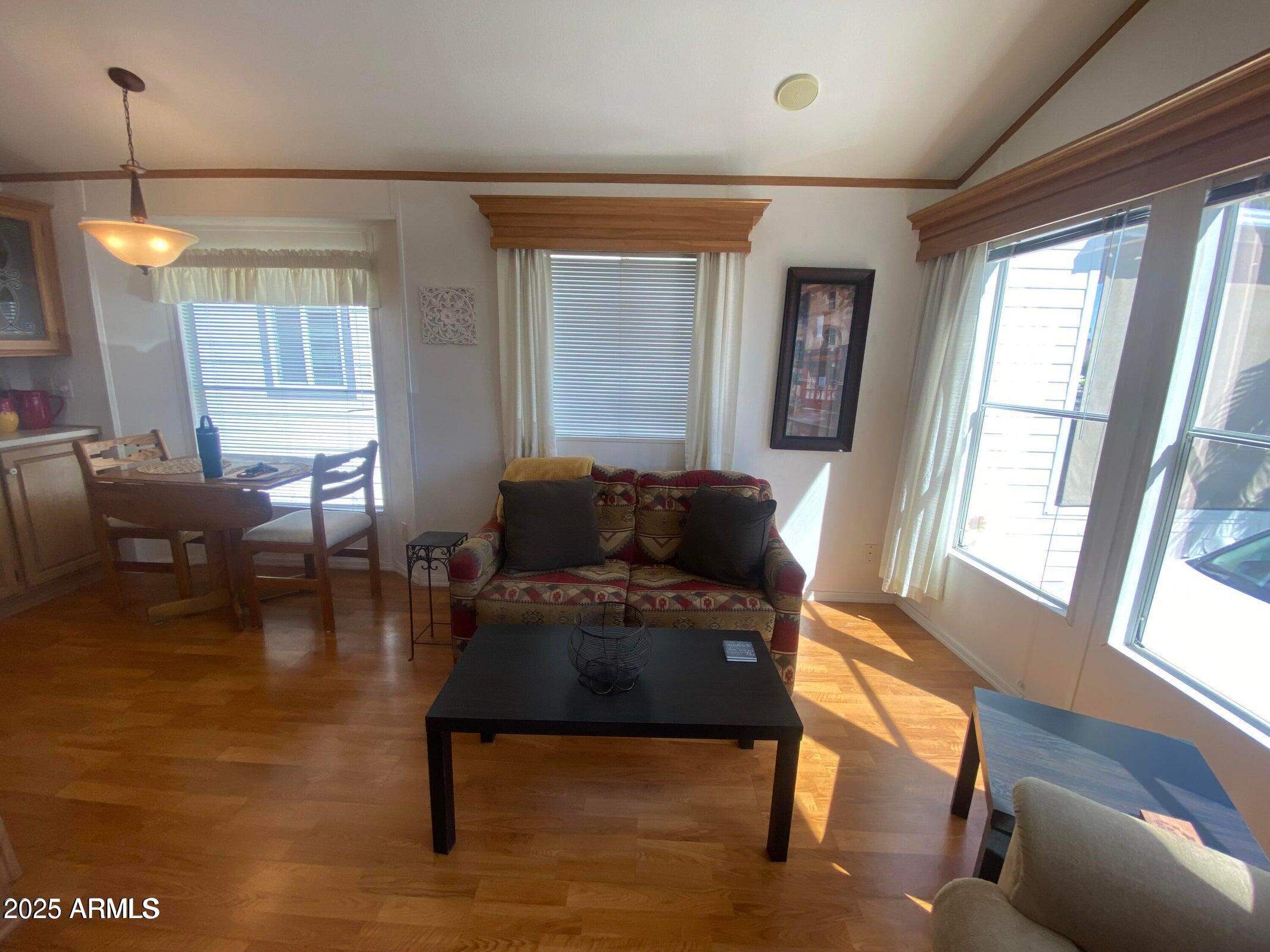 1426 South Havasupai Drive Apache Junction, AZ 85119 - Photo 3 of 32 a living room with furniture and a table