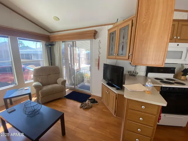 a livingroom with workspace and a window