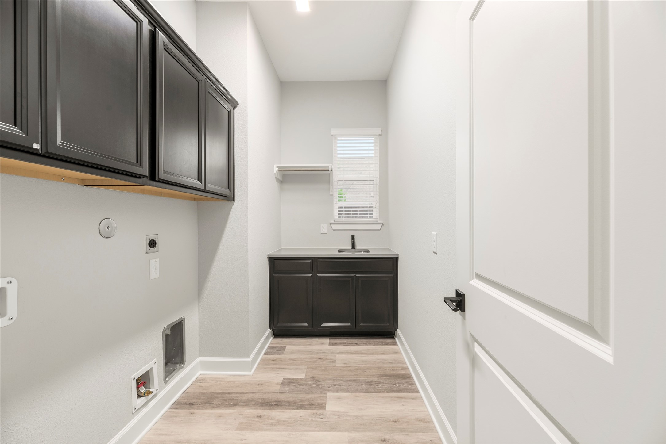 3438 Rich Radish Road Richmond, TX 77406 - Photo 17 of 25 Experience convenience with the in-house utility room, thoughtfully designed with a dedicated laundry area.