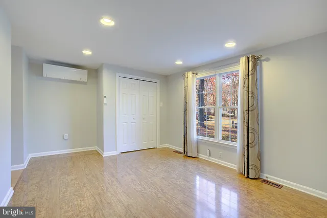 an empty room with entrance door