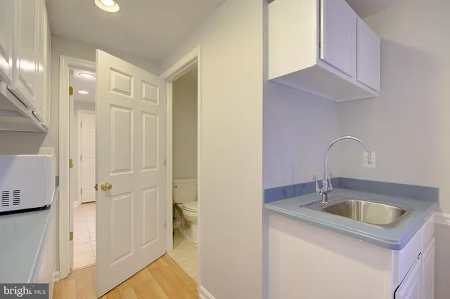 a bathroom with a sink and a shower