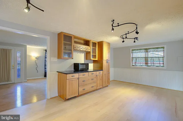 a kitchen with stainless steel appliances granite countertop a sink and cabinets