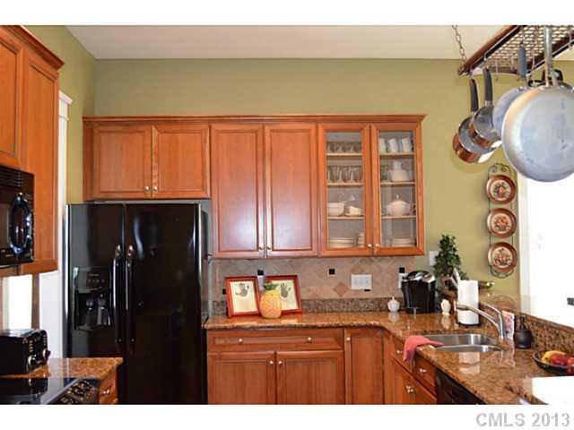 113 Mills Lane Fort Mill, SC 29708 - Photo 5 of 16 a kitchen with a sink cabinets and a window