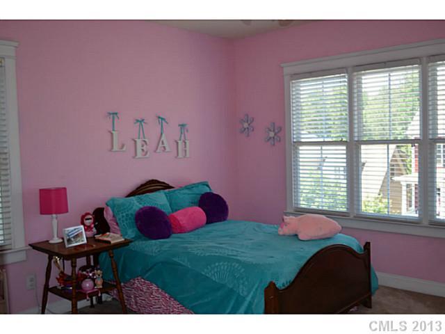 113 Mills Lane Fort Mill, SC 29708 - Photo 9 of 16 a bedroom with a bed and a table in it