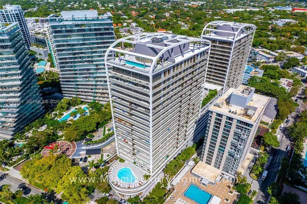 a view of a swimming pool with outdoor seating