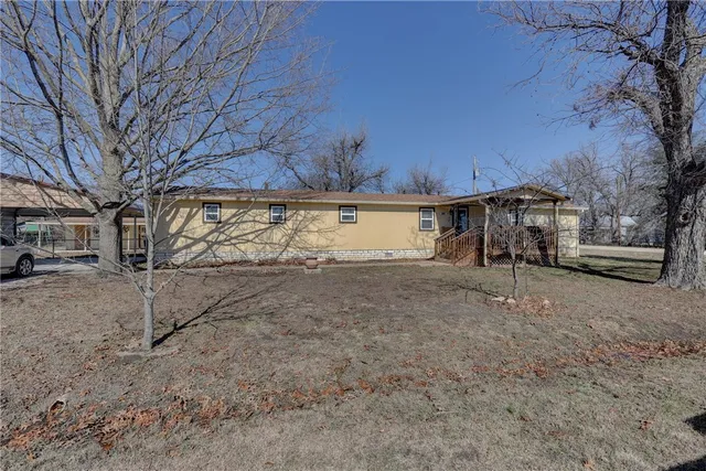 a view of a house with a snow in the yard