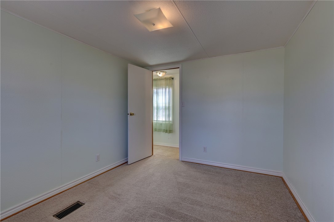 117 Denmark Street Walnut Springs, TX 76690 - Photo 22 of 40 an empty room with window