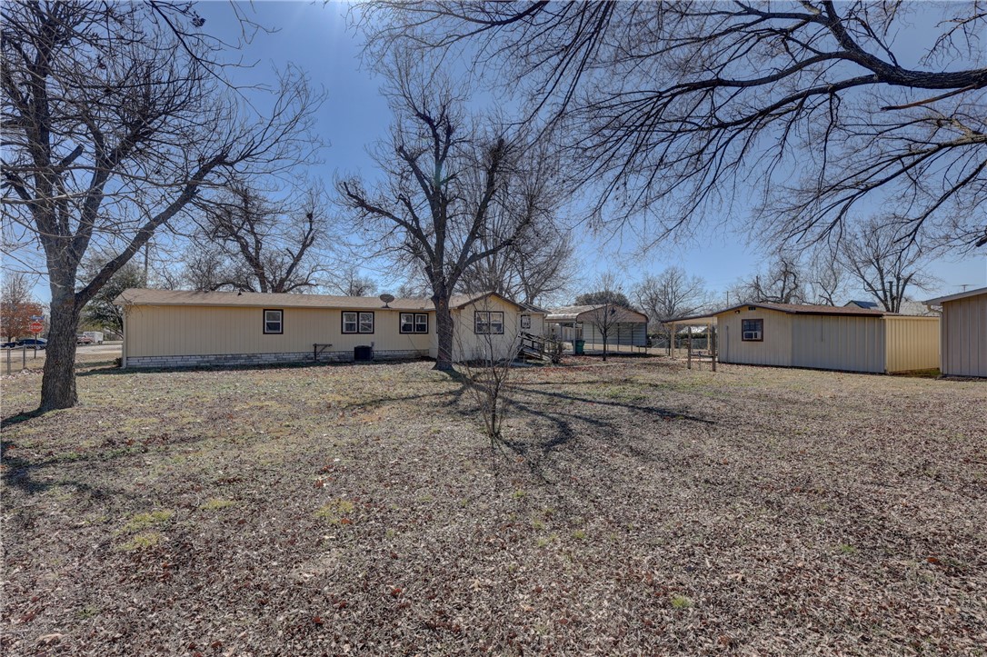 117 Denmark Street Walnut Springs, TX 76690 - Photo 29 of 40 a view of a yard covered with snow in the yard