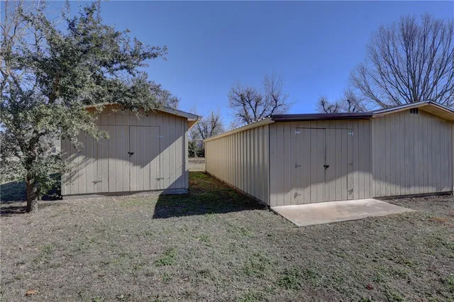 a house with trees in the background