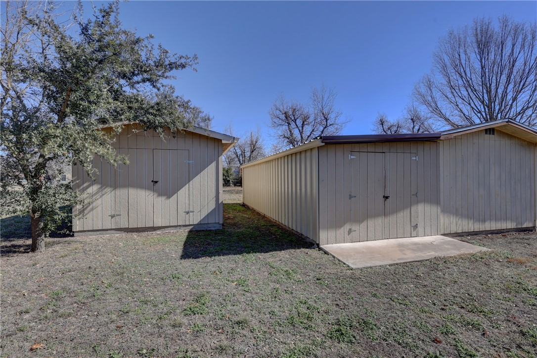 117 Denmark Street Walnut Springs, TX 76690 - Photo 30 of 40 a view of a house with a yard