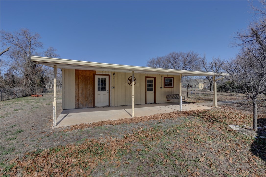 117 Denmark Street Walnut Springs, TX 76690 - Photo 32 of 40 a house with trees in the background