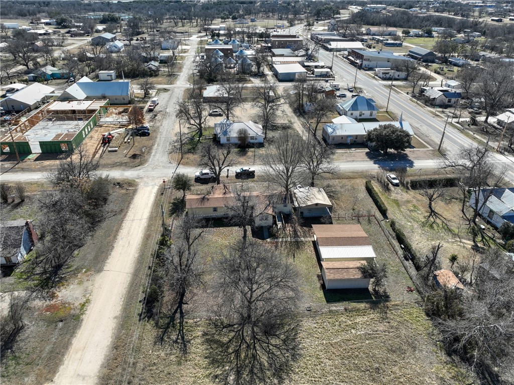 117 Denmark Street Walnut Springs, TX 76690 - Photo 37 of 40 an aerial view of a house with a yard