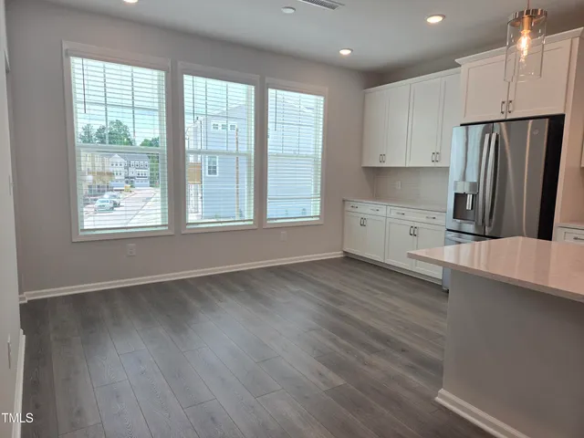 a kitchen with stainless steel appliances a refrigerator and a sink