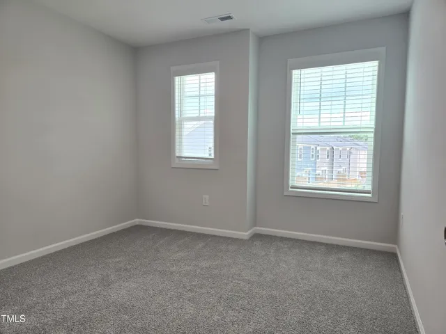 a bathroom with a sink a toilet and a large mirror