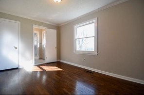203 James Avenue Franklin, TN 37064 - Photo 11 of 26 an empty room with wooden floor and windows