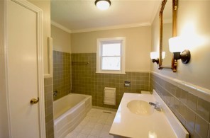 203 James Avenue Franklin, TN 37064 - Photo 15 of 26 a bathroom with a tub sink and mirror