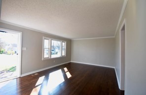 203 James Avenue Franklin, TN 37064 - Photo 17 of 26 a view of an empty room with wooden floor and a window