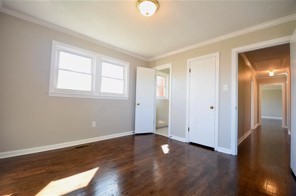 203 James Avenue Franklin, TN 37064 - Photo 8 of 26 an empty room with wooden floor and windows