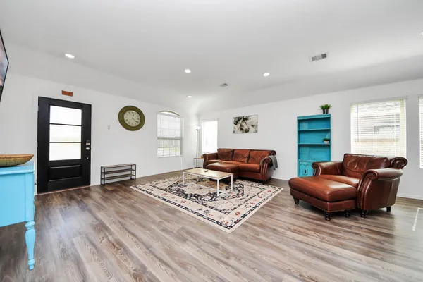 a living room with furniture and a window