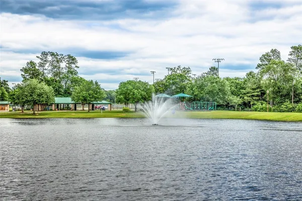 a view of a swimming pool and a yard