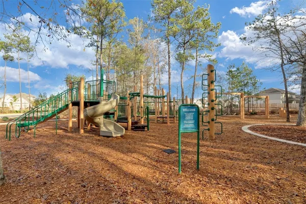 a view of a park with swings and slides