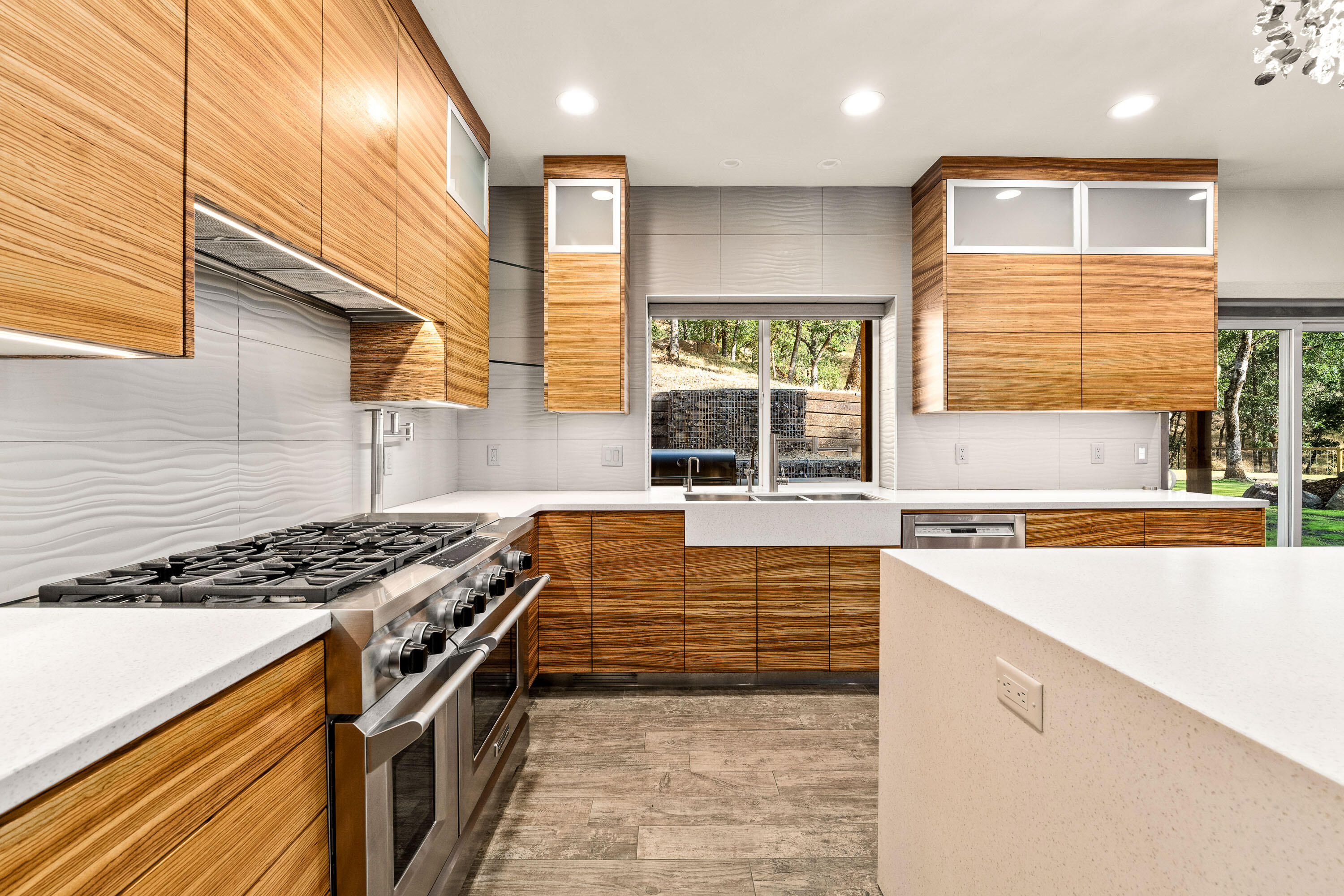 182 Wards Creek Road Rogue River, OR 97537 - Photo 10 of 80 a kitchen with stainless steel appliances granite countertop a stove a sink and a microwave